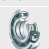 Four point contact ball bearing with retaining slots